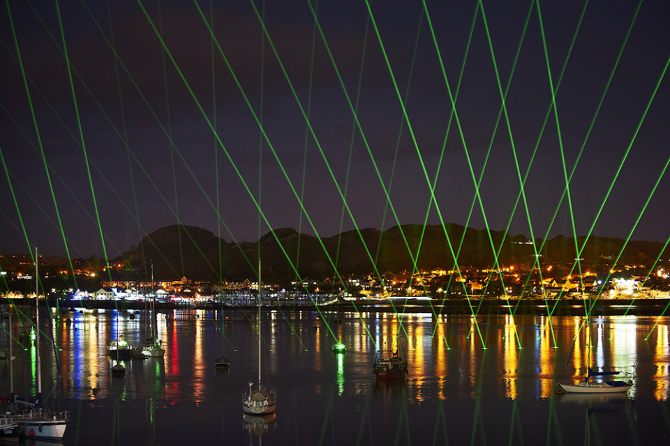 Lasers pulsing Thank You into the estuary and heavens